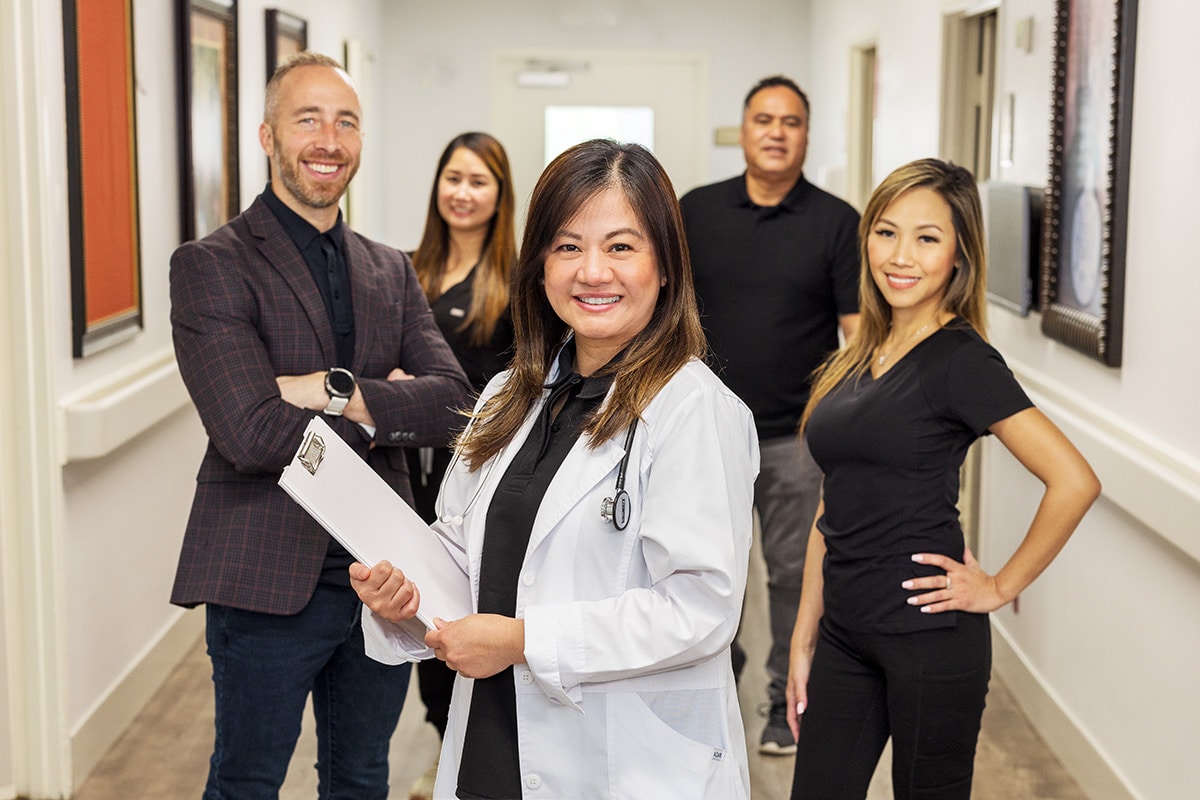 Staff smiling in the hallway